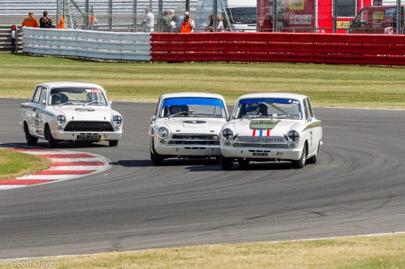 It was a Lotus Cortina 1-2-3 in the Sir John Whitmore Trophy for Under 2 Litre Touring Cars with the Voyazides/Hadfield car seen here in the centre of the picture taking the win.
